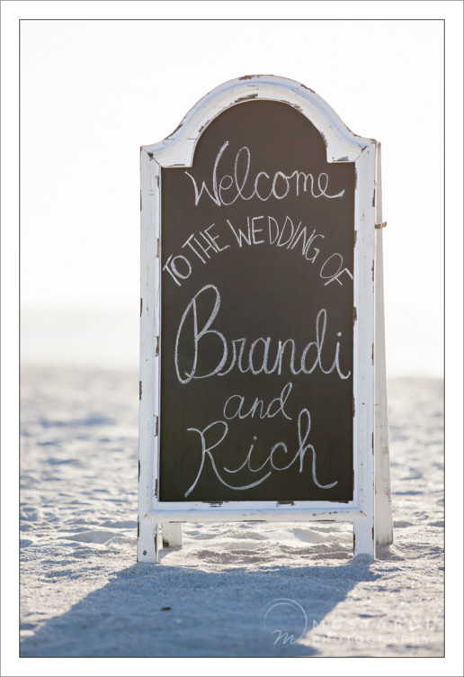 Beach wedding welcome sign at Pass-A-Grille Beach in St. Pete Beach, Florida.