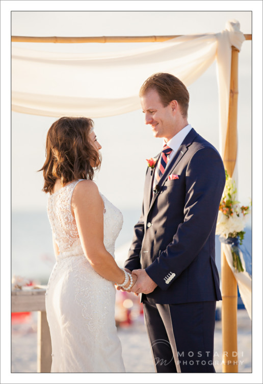 Couple getting married on the beach at Pass-A-Grille Beach in St. Pete, Florida.